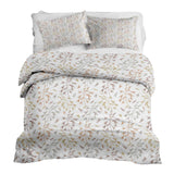 Set de ropa de cama con mantas terapéuticas y delicadas ramas coloridas