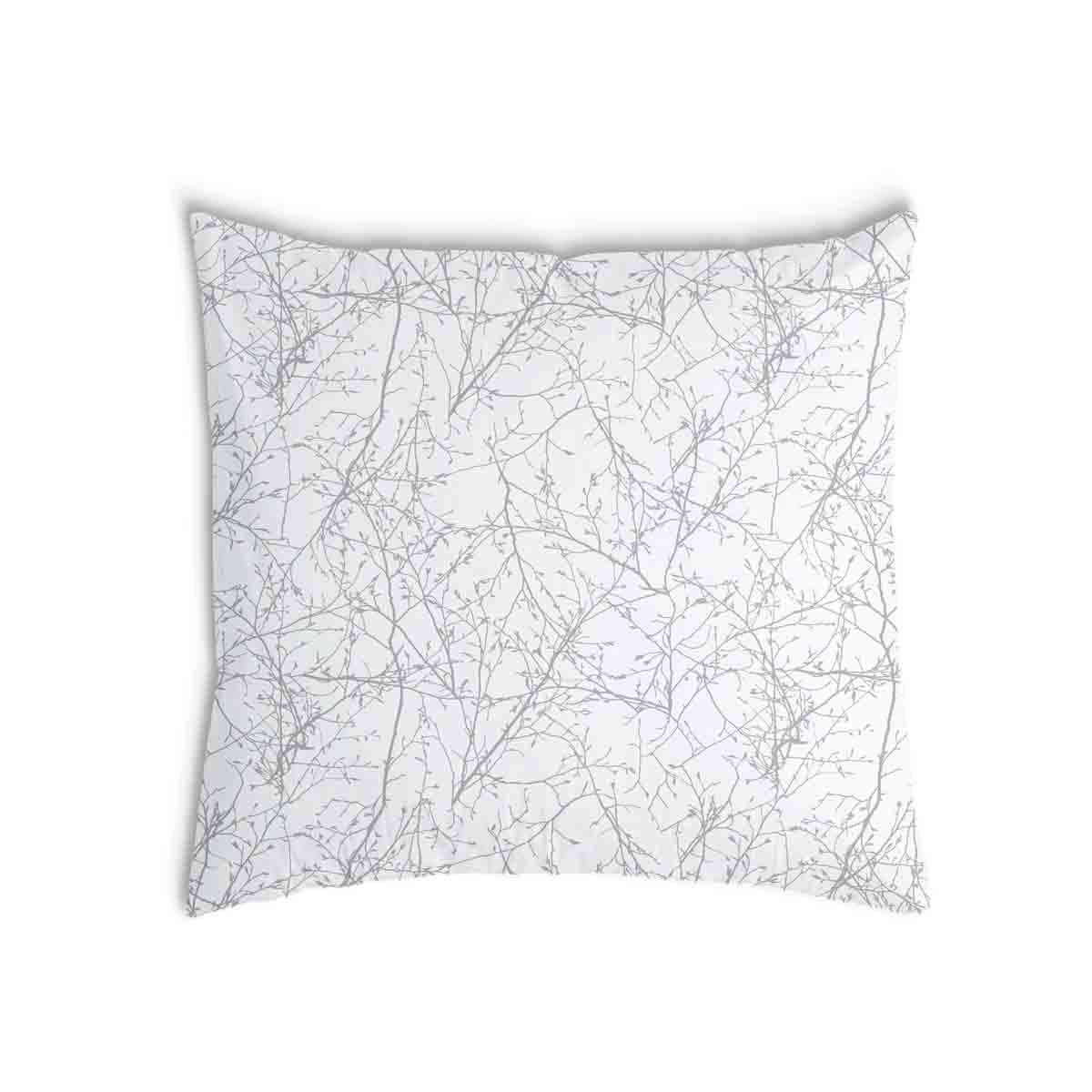 Almohada de salud blanca con delicadas ramas grises