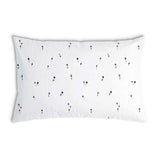 Almohada de salud blanca con dientes de león negros