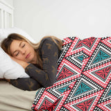 Set de ropa de cama con mantas terapéuticas y triángulos coloridos