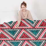 Set de ropa de cama con mantas terapéuticas y triángulos coloridos