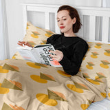 Set de ropa de cama con mantas terapéuticas y formas amarillas