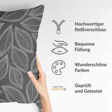 Almohada de salud gris con hojas de palma blancas