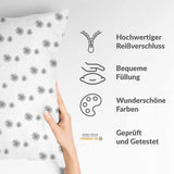 Almohada de salud blanca con borlas grises
