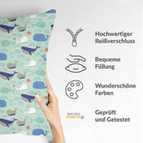 Almohada de salud verde con ballenas