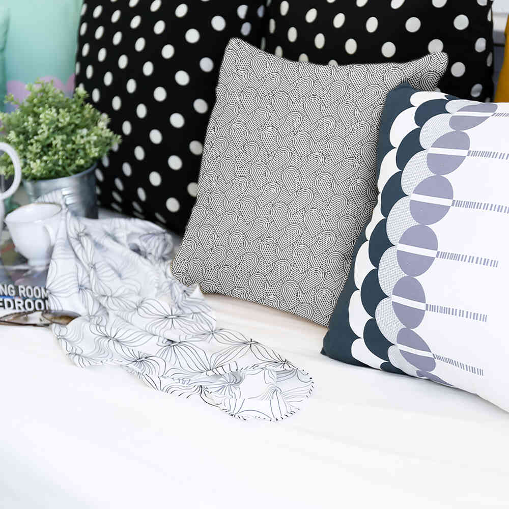 Almohada de salud gris corazones geométricos