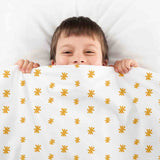 Set de ropa de cama con manta terapéutica y flores amarillas