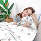 Juego de ropa de cama con manta terapéutica blanca con estrellas rosas
