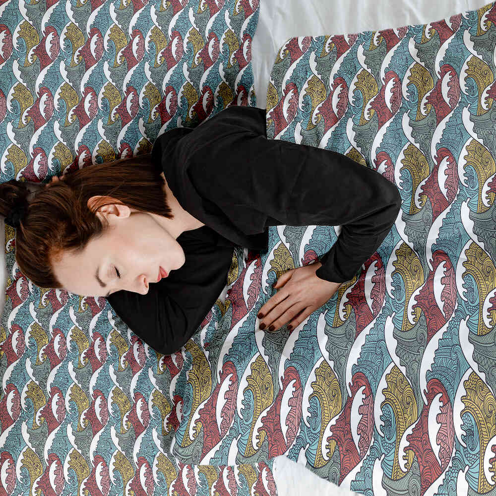 Set de ropa de cama con mantas terapéuticas y rompeolas coloridos