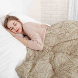 Juego de ropa de cama con manta terapéutica beige con forma de hoja negra