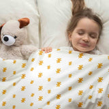 Set de ropa de cama con manta terapéutica y flores amarillas