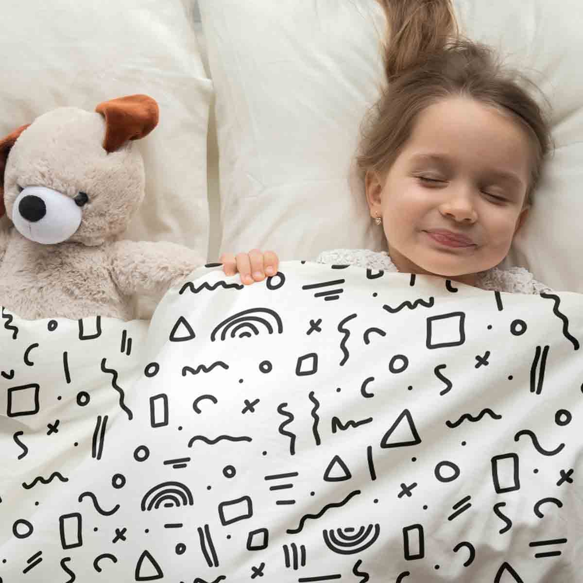 Set de ropa de cama con mantas terapéuticas blanco con formas en negro