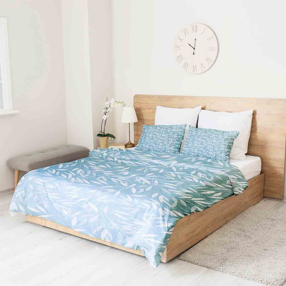 Set de ropa de cama con mantas terapéuticas y ramas azules