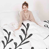 Juego de ropa de cama con manta terapéutica blanca con ramas negras
