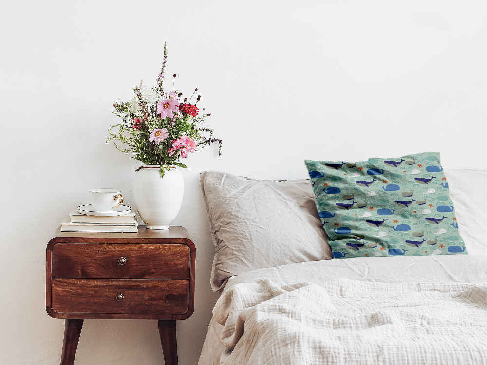 Almohada de salud verde con ballenas