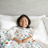Set de ropa de cama con mantas terapéuticas y dinosaurios coloridos