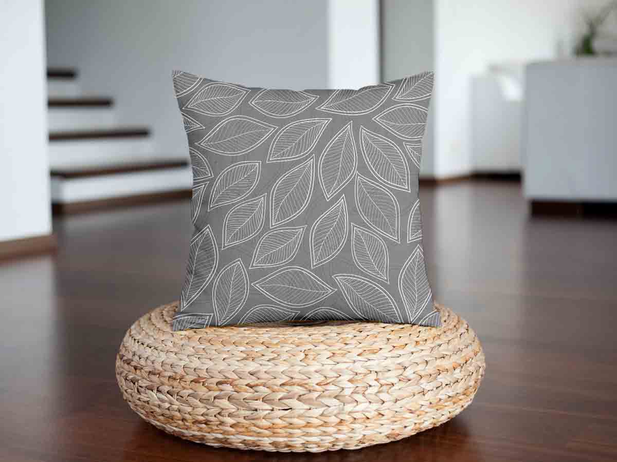 Almohada de salud gris con hojas de palma blancas