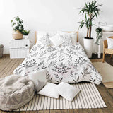 Juego de ropa de cama con manta terapéutica blanca con ramas negras