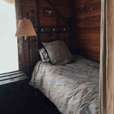 Juego de ropa de cama con mantas terapéuticas y hojas de palma coloridas