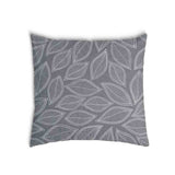 Almohada de salud gris con hojas de palma blancas