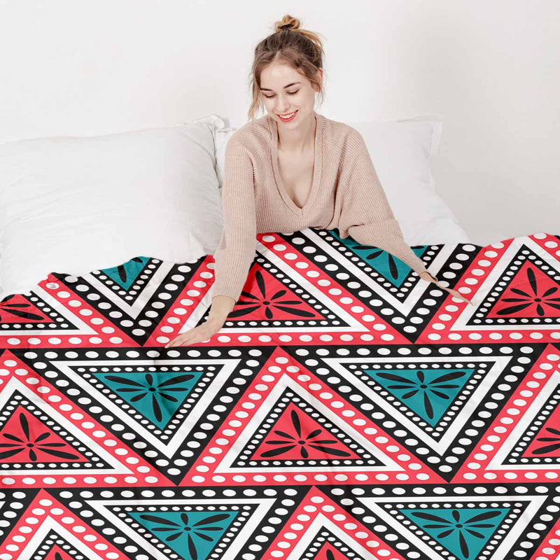 Set de ropa de cama con mantas terapéuticas y triángulos coloridos