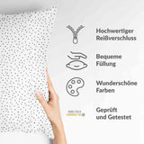 Almohada de salud negra con puntos