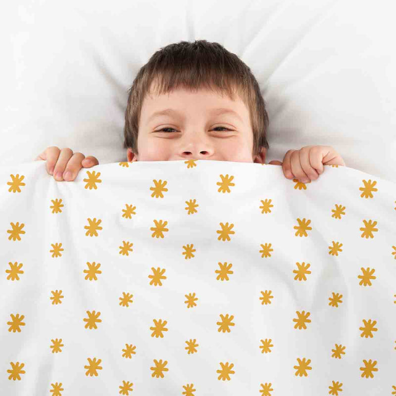 Set de ropa de cama con manta terapéutica y flores amarillas