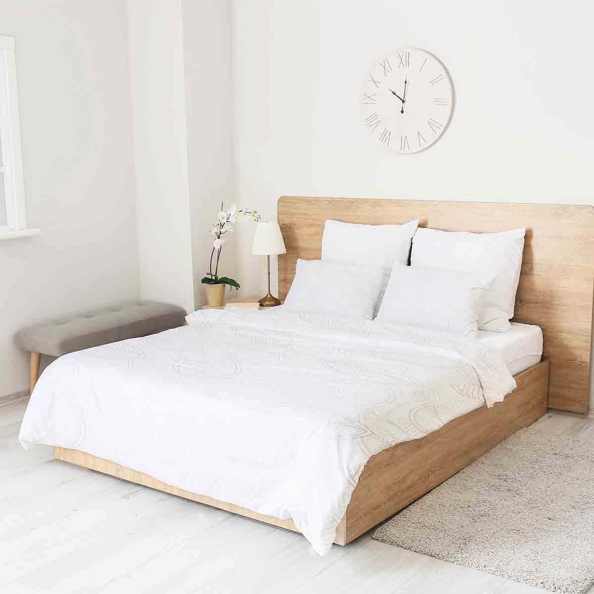 Set de ropa de cama con mantas terapéuticas y hojas de palma grises