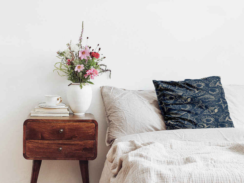 Almohada de salud azul con conchas