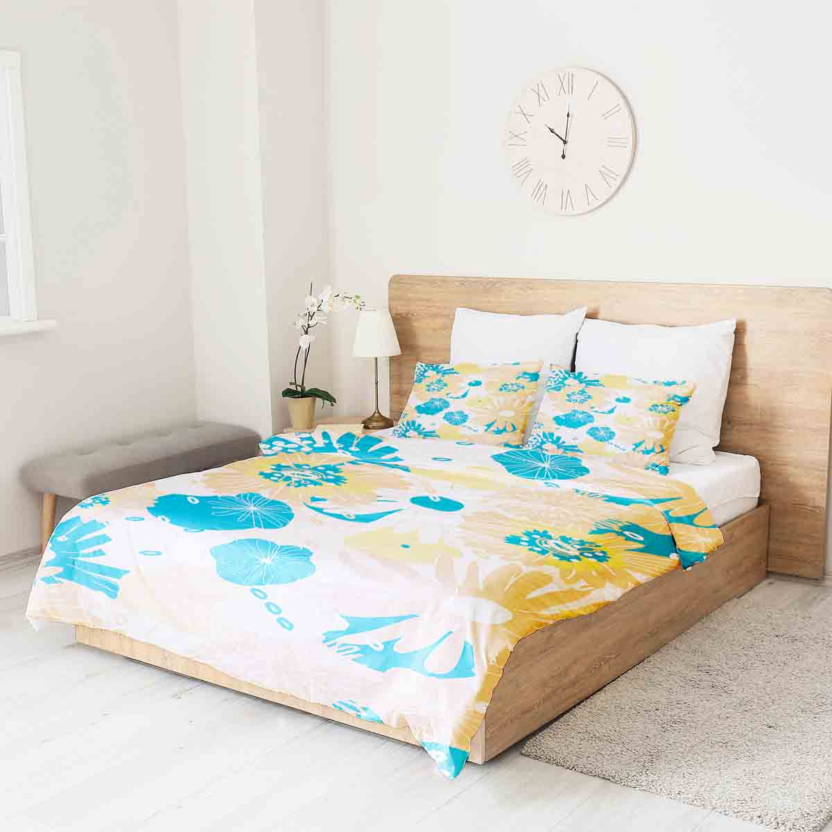 Set de ropa de cama con mantas terapéuticas y flores de gerbera
