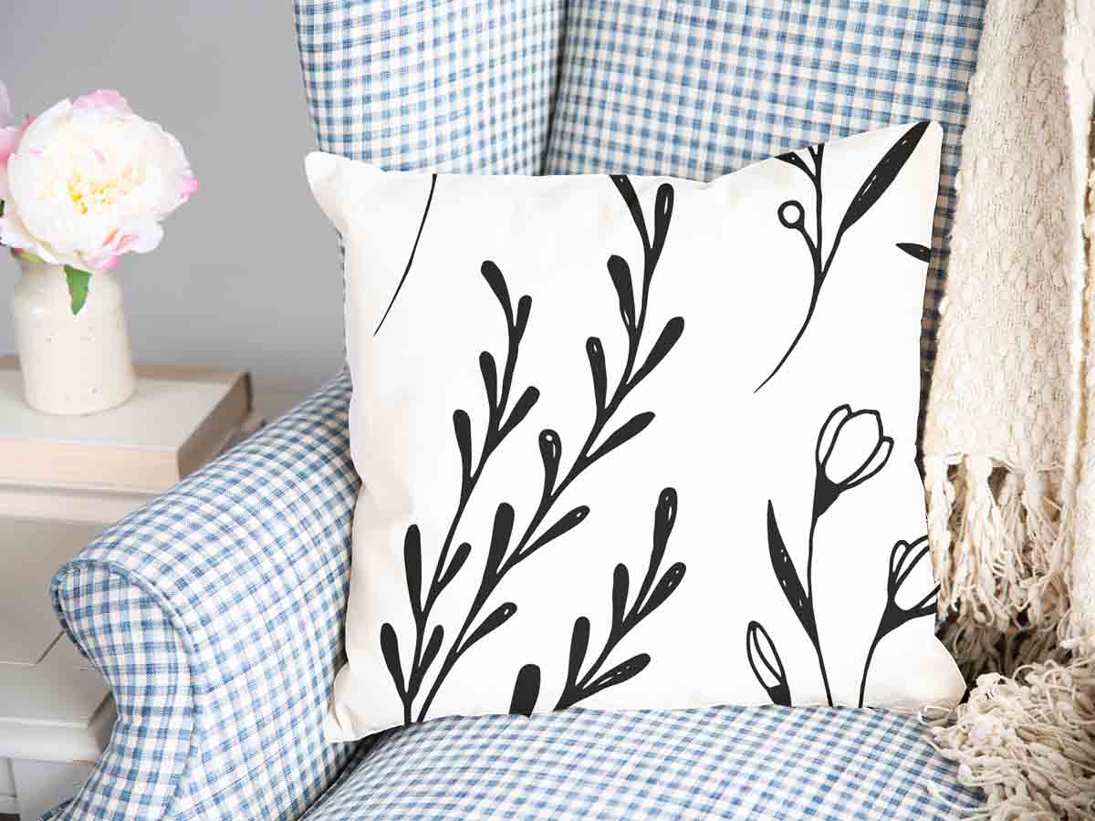 Almohada de salud blanca con ramas negras