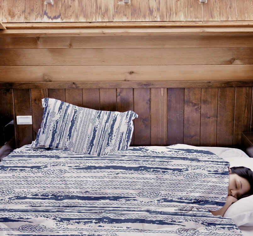 Set de ropa de cama con manta terapéutica y patrón a rayas