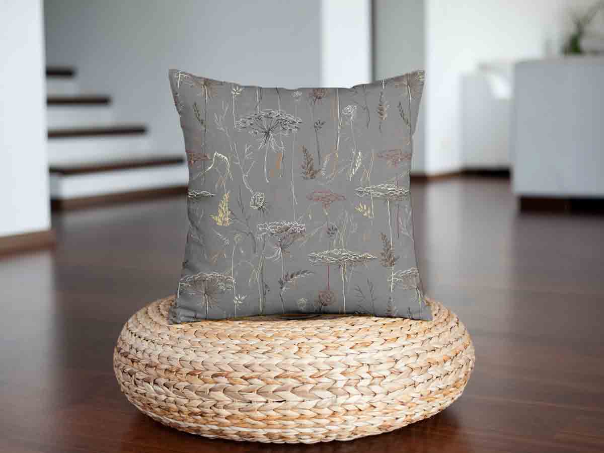 Almohada de salud gris con plantas doradas