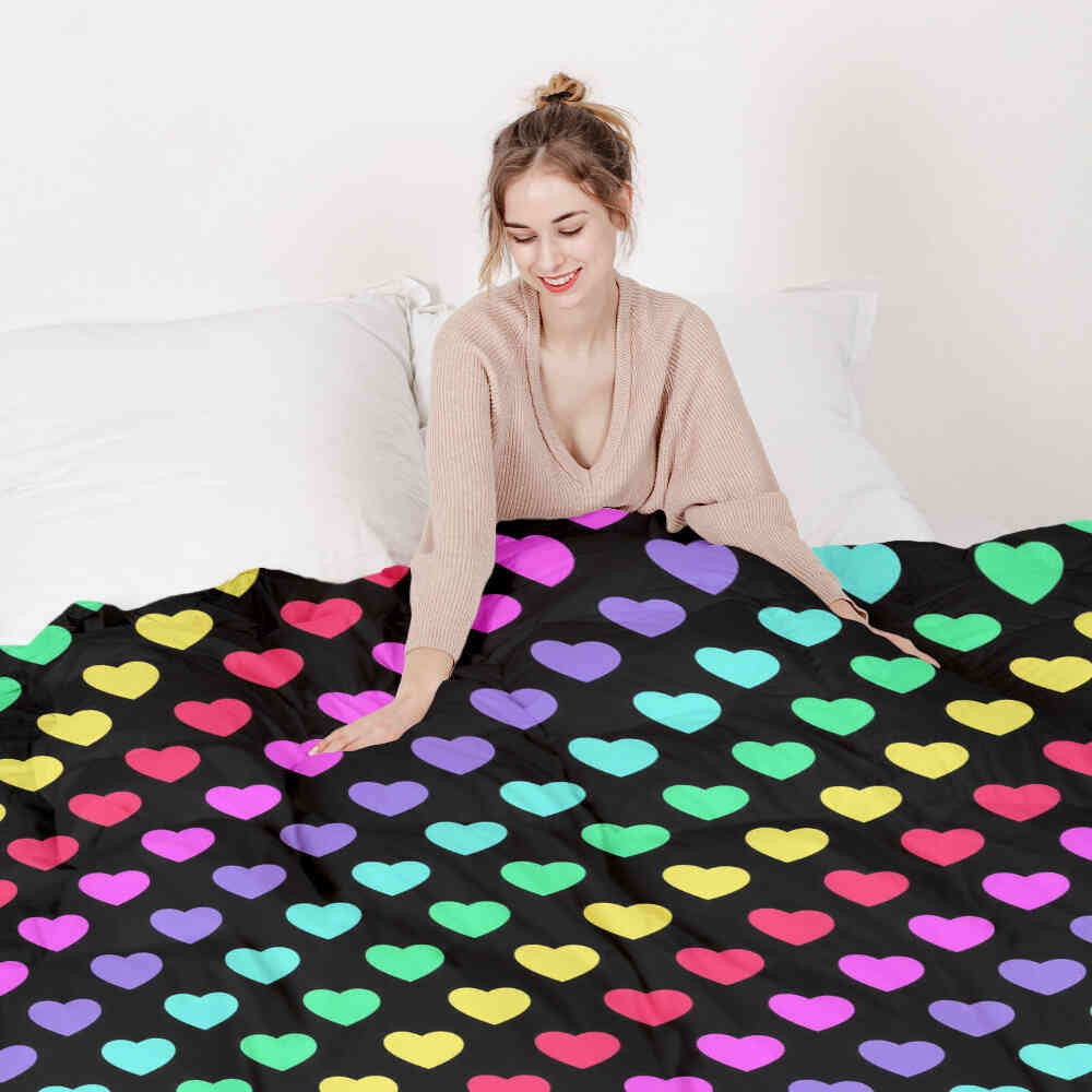 Set de ropa de cama con mantas terapéuticas y corazones coloridos