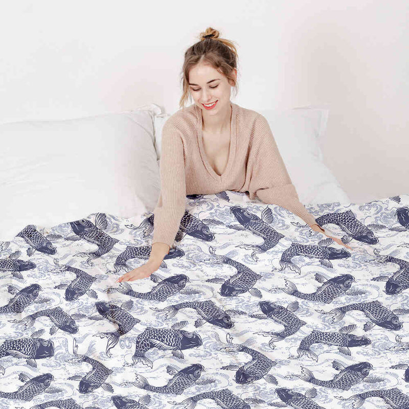 Set de ropa de cama con mantas terapéuticas y kois azules